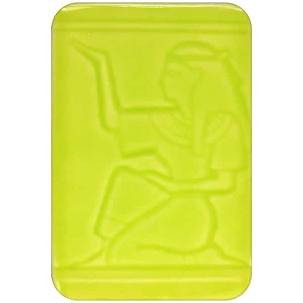 White clay tile featuring an imprint of a kneeling pharoah glazed with Spectrum 1467 Spring Green Semi-Transparent Glazepooled into the indentations