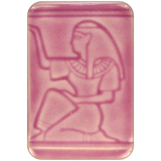 White clay tile featuring an imprint of a kneeling pharoah glazed with Spectrum 1471 Orchid Semi-Transparent Glazepooled into the indentations