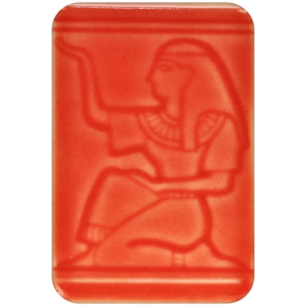 White clay tile featuring an imprint of a kneeling pharoah glazed with Spectrum 1472 Watermelon Semi-Transparent Glazepooled into the indentations